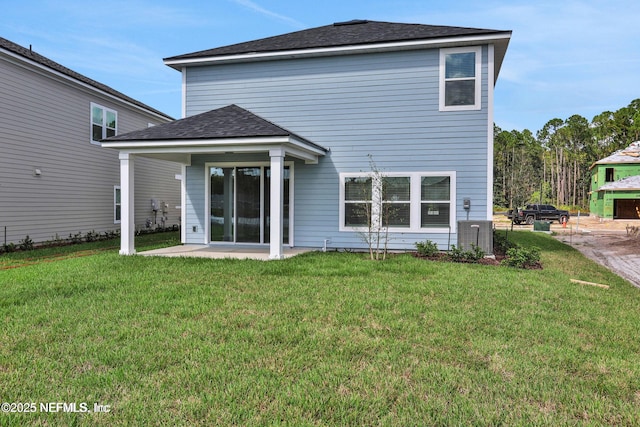 386 Whirlwind Pl, Saint Johns, FL 32095 - back of property with a yard, roof with shingles, and a patio