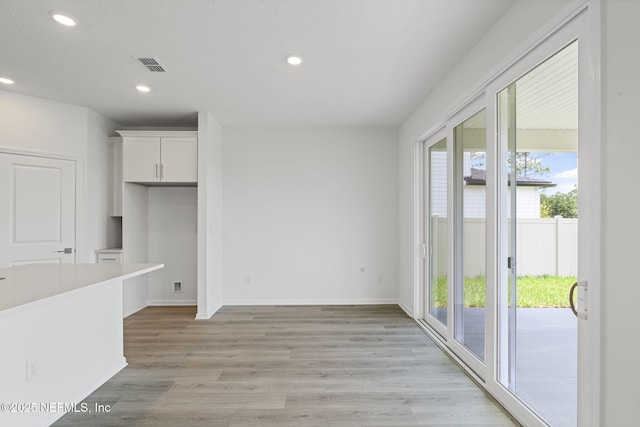 386 Whirlwind Pl, Saint Johns, FL 32095 - unfurnished dining area with healthy amount of natural light, recessed lighting, and light wood finished floors
