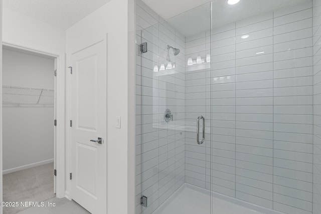386 Whirlwind Pl, Saint Johns, FL 32095 - bathroom featuring a shower stall, a walk in closet, and recessed lighting