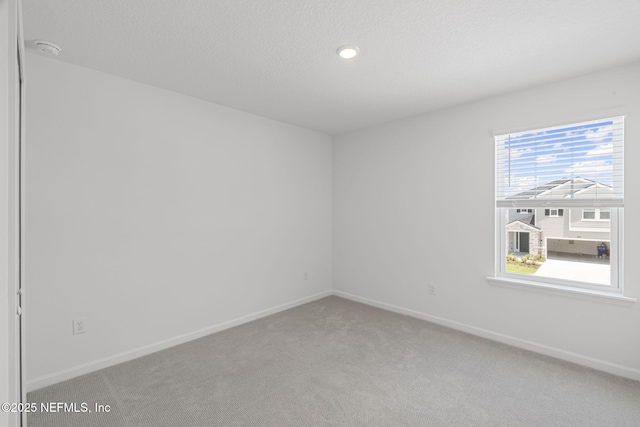 386 Whirlwind Pl, Saint Johns, FL 32095 - empty room with light colored carpet, a smoke detector, a textured ceiling, and recessed lighting