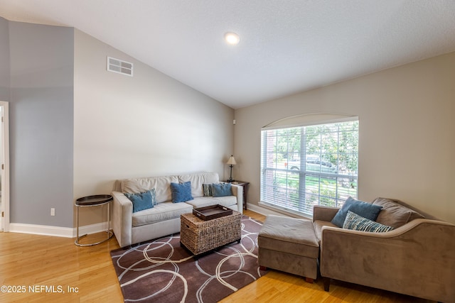 4521 Deep River Way E, Jacksonville, FL 32224 - living area with vaulted ceiling and wood finished floors