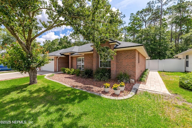 4521 Deep River Way E, Jacksonville, FL 32224 - view of front of home with brick siding, an attached garage, a shingled roof, and driveway