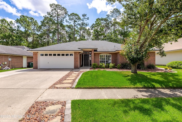 4521 Deep River Way E, Jacksonville, FL 32224 - ranch-style home with brick siding, a garage, driveway, and a front yard