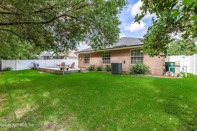 4521 Deep River Way E, Jacksonville, FL 32224 - rear view of property with brick siding, a fenced backyard, and a patio area