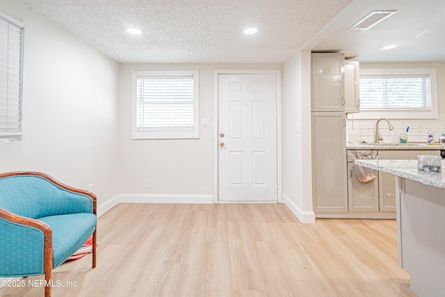 1841 W 11th St, Jacksonville, FL 32209 - sitting room with light wood finished floors, a textured ceiling, recessed lighting, and healthy amount of natural light