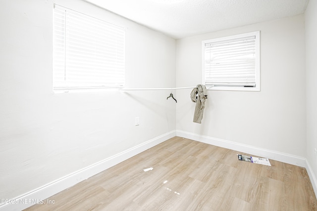 1841 W 11th St, Jacksonville, FL 32209 - empty room featuring wood finished floors and a textured ceiling