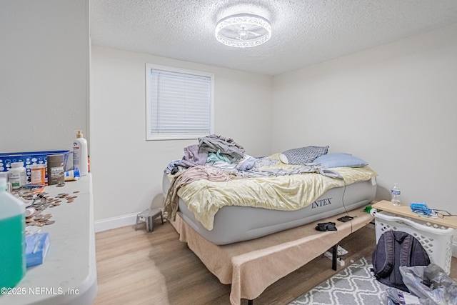 1841 W 11th St, Jacksonville, FL 32209 - bedroom with a textured ceiling and wood finished floors