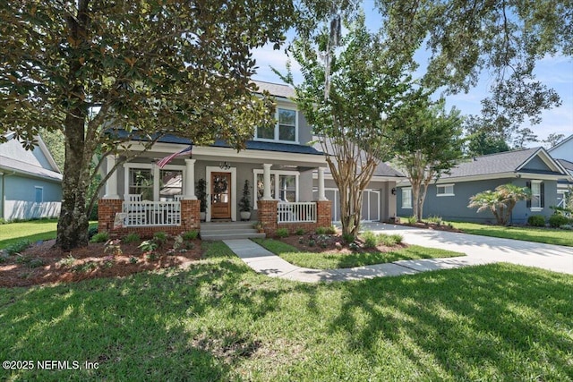 1060 Meadow View Ln, Saint Augustine, FL 32092 - view of front of home with a porch, a front yard, a garage, and concrete driveway