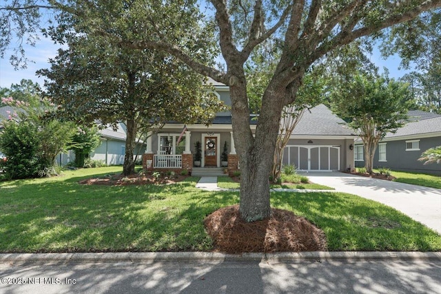 1060 Meadow View Ln, Saint Augustine, FL 32092 - obstructed view of property with concrete driveway, a front yard, an attached garage, and a porch
