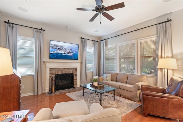 1060 Meadow View Ln, Saint Augustine, FL 32092 - living room with wood finished floors, ceiling fan, and a fireplace
