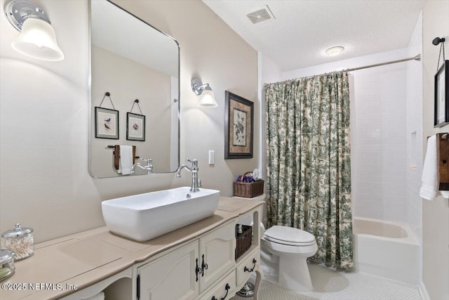 1060 Meadow View Ln, Saint Augustine, FL 32092 - bathroom featuring vanity, shower / bath combo with shower curtain, tile patterned floors, and a textured ceiling