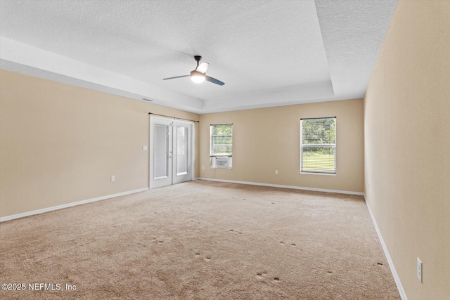 3728 W Florentine Dr, Citrus Springs, FL 34433 - empty room with ceiling fan, carpet floors, a textured ceiling, a tray ceiling, and cooling unit