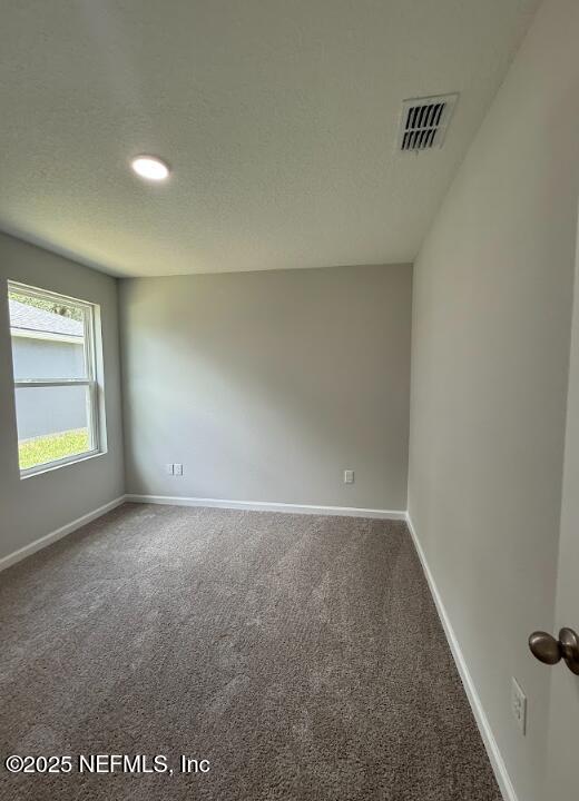 8045 Driggers St, Jacksonville, FL 32220 - spare room featuring carpet flooring