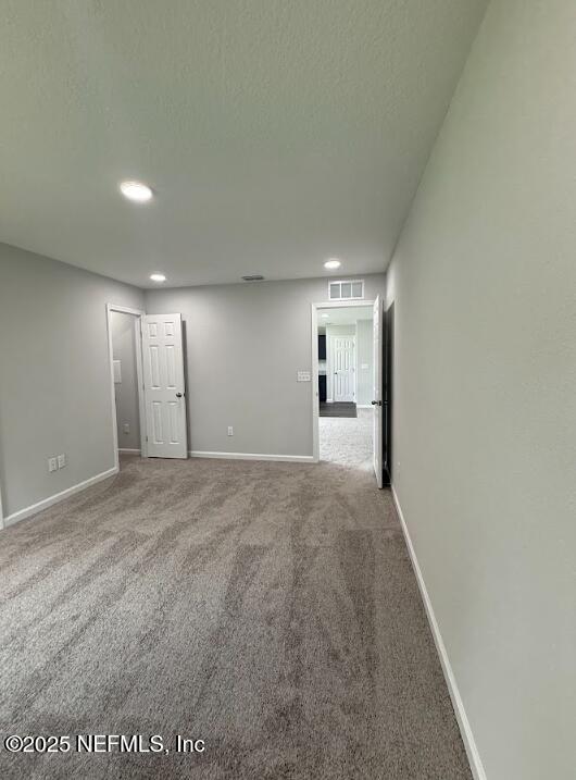 8045 Driggers St, Jacksonville, FL 32220 - carpeted spare room with recessed lighting and a textured ceiling