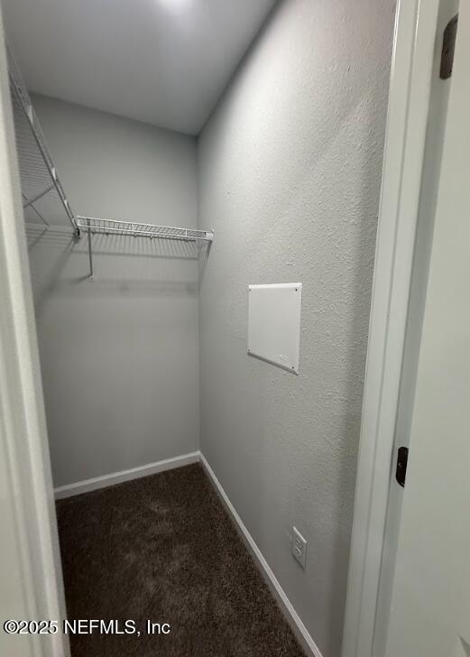 8045 Driggers St, Jacksonville, FL 32220 - spacious closet featuring dark colored carpet