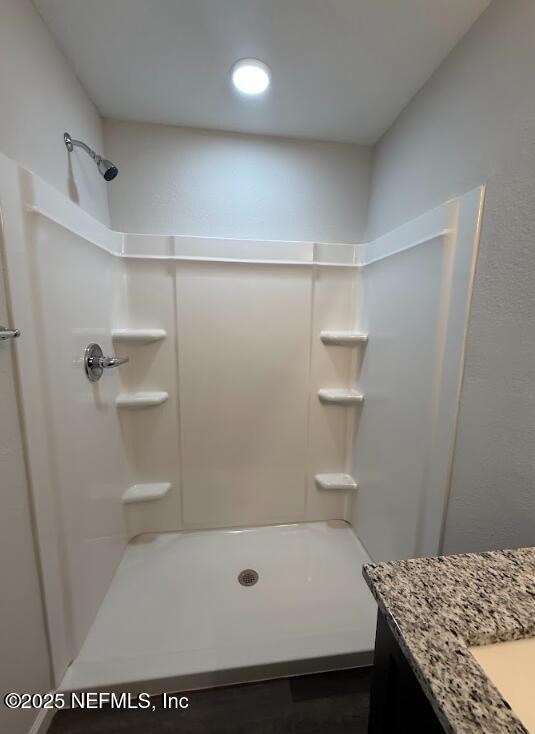 8045 Driggers St, Jacksonville, FL 32220 - full bathroom featuring vanity and a shower