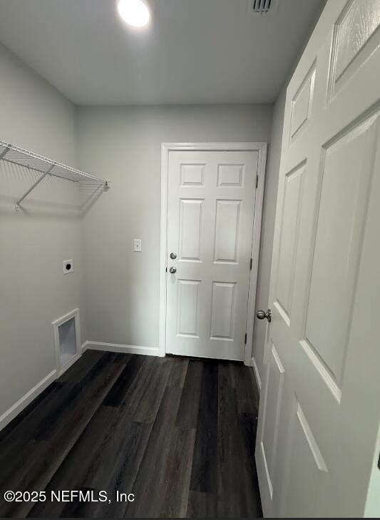 8045 Driggers St, Jacksonville, FL 32220 - laundry room with electric dryer hookup and dark wood-style floors