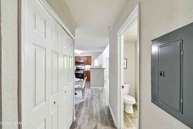 8550 Touchton Rd Unit 932, Jacksonville, FL 32216 - corridor with light wood-style flooring and baseboards