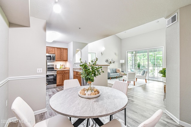 8550 Touchton Rd Unit 932, Jacksonville, FL 32216 - dining area featuring light wood-type flooring and baseboards