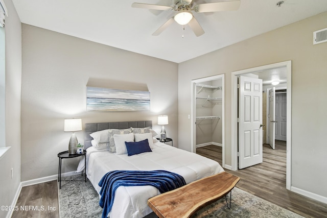 8550 Touchton Rd Unit 932, Jacksonville, FL 32216 - bedroom with wood finished floors, a walk in closet, a closet, and a ceiling fan