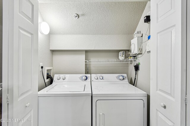 8550 Touchton Rd Unit 932, Jacksonville, FL 32216 - laundry area featuring separate washer and dryer and a textured ceiling