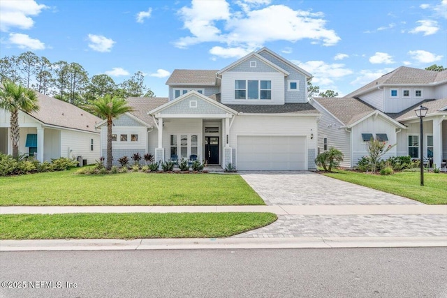 351 Palm Crst Dr, Ponte Vedra, FL 32081 - view of front facade with decorative driveway, a front yard, and an attached garage