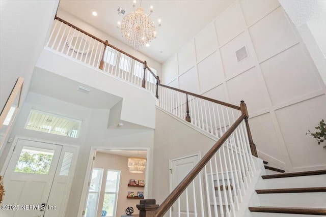 351 Palm Crst Dr, Ponte Vedra, FL 32081 - staircase with a chandelier, a towering ceiling, and recessed lighting