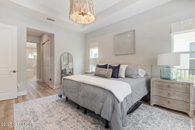 351 Palm Crst Dr, Ponte Vedra, FL 32081 - bedroom featuring wood finished floors, multiple windows, and a chandelier