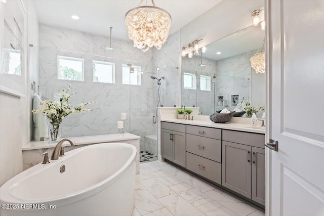 351 Palm Crst Dr, Ponte Vedra, FL 32081 - full bathroom with double vanity, marble look tiles, a marble finish shower, a soaking tub, and healthy amount of natural light