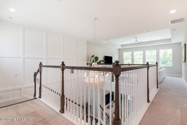 351 Palm Crst Dr, Ponte Vedra, FL 32081 - hallway with a decorative wall, carpet floors, an upstairs landing, a tray ceiling, and recessed lighting