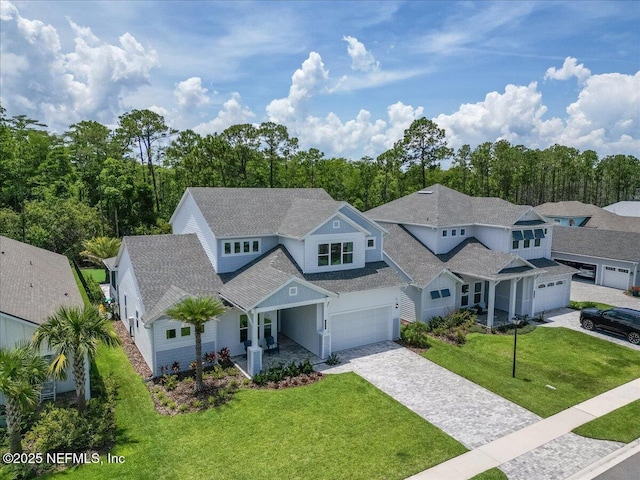 351 Palm Crst Dr, Ponte Vedra, FL 32081 - view of front of property featuring decorative driveway, a front lawn, a garage, and a shingled roof