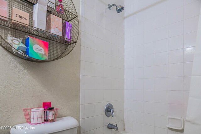 5811 Atlantic Blvd Unit 115, Jacksonville, FL 32207 - full bathroom featuring a textured wall and shower / washtub combination