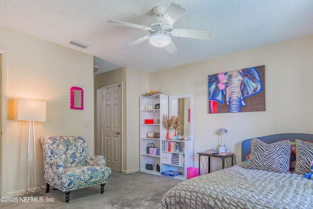 5811 Atlantic Blvd Unit 115, Jacksonville, FL 32207 - carpeted bedroom with a textured ceiling and ceiling fan