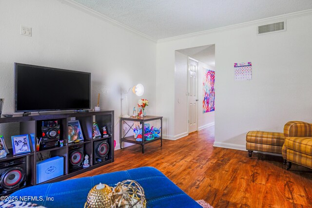 5811 Atlantic Blvd Unit 115, Jacksonville, FL 32207 - living room with ornamental molding, wood finished floors, and a textured ceiling