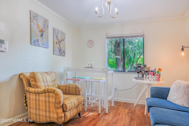 5811 Atlantic Blvd Unit 115, Jacksonville, FL 32207 - living area featuring crown molding, wood finished floors, a chandelier, and a textured ceiling