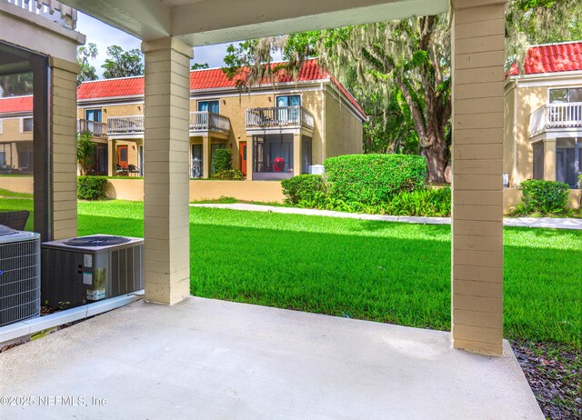 5811 Atlantic Blvd Unit 115, Jacksonville, FL 32207 - view of green lawn featuring a balcony and a patio