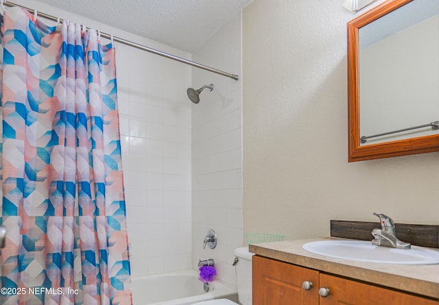 5811 Atlantic Blvd Unit 115, Jacksonville, FL 32207 - bathroom featuring vanity, shower / bath combo with shower curtain, a textured ceiling, and a textured wall