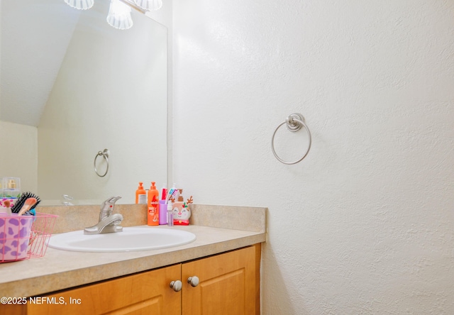 5811 Atlantic Blvd Unit 115, Jacksonville, FL 32207 - bathroom featuring vanity and vaulted ceiling