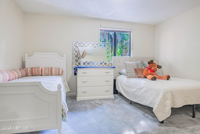5811 Atlantic Blvd Unit 115, Jacksonville, FL 32207 - carpeted bedroom with a textured ceiling