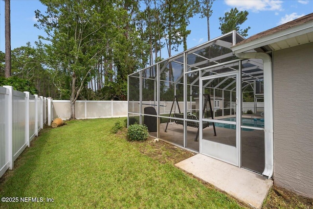45 E Diamond Dr, Palm Coast, FL 32164 - fenced backyard featuring a patio and glass enclosure
