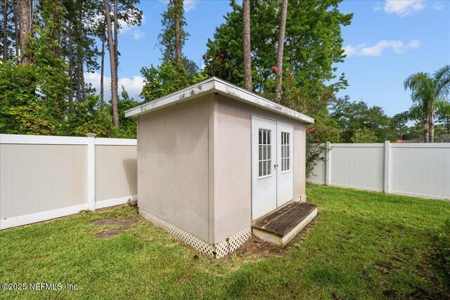 45 E Diamond Dr, Palm Coast, FL 32164 - view of shed featuring a fenced backyard