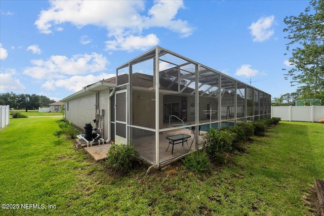 45 E Diamond Dr, Palm Coast, FL 32164 - back of property featuring a patio area and glass enclosure