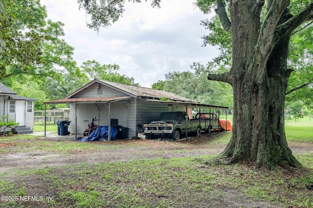 85215 Airplane Ln, Yulee, FL 32097 - view of outbuilding featuring a carport