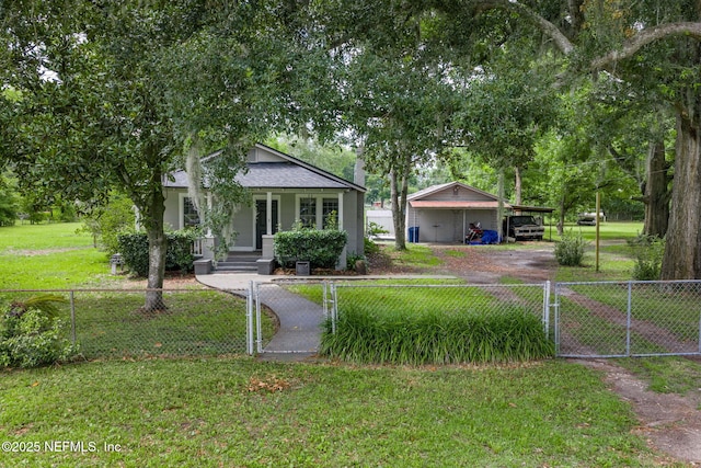85215 Airplane Ln, Yulee, FL 32097 - bungalow featuring a gate, a carport, a fenced front yard, and a porch
