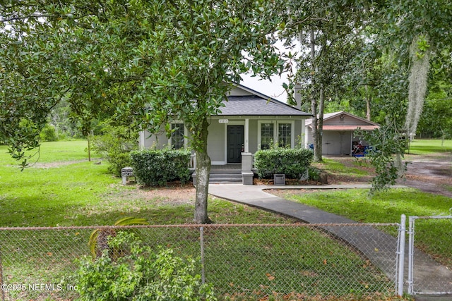 85215 Airplane Ln, Yulee, FL 32097 - view of front of property with a porch, a fenced front yard, and a shingled roof