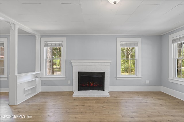 85215 Airplane Ln, Yulee, FL 32097 - unfurnished living room with a brick fireplace, wood finished floors, and crown molding