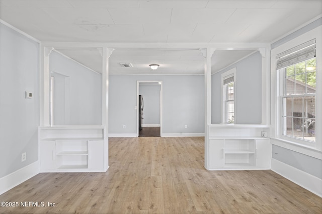 85215 Airplane Ln, Yulee, FL 32097 - empty room featuring light wood-type flooring and crown molding
