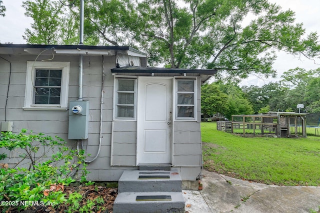 85215 Airplane Ln, Yulee, FL 32097 - view of exterior entry with a yard