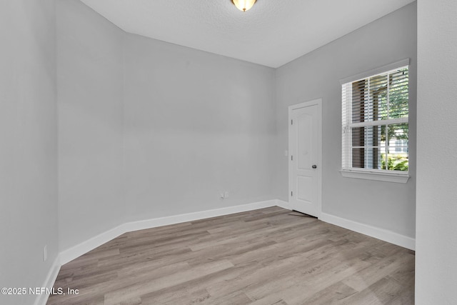 4431 Vista Point Ln, Orange Park, FL 32065 - spare room featuring wood finished floors and a textured ceiling