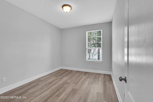 4431 Vista Point Ln, Orange Park, FL 32065 - spare room featuring wood finished floors and a textured ceiling